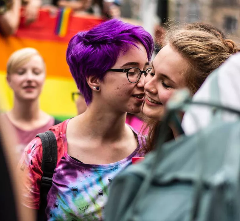 gay youth displaying affection at LGBTQ+ Pride event | Covenant House